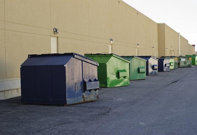 a stack of heavy construction dumpsters waiting to be emptied in Bell